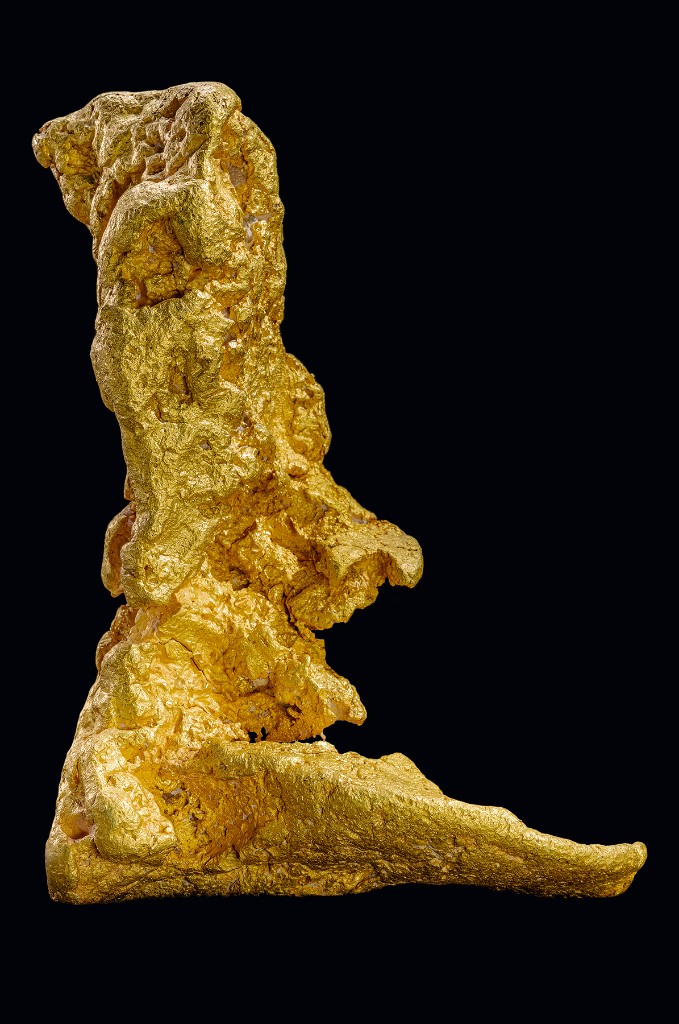 The Boot of Cortez natural gold nugget, full-length view on black