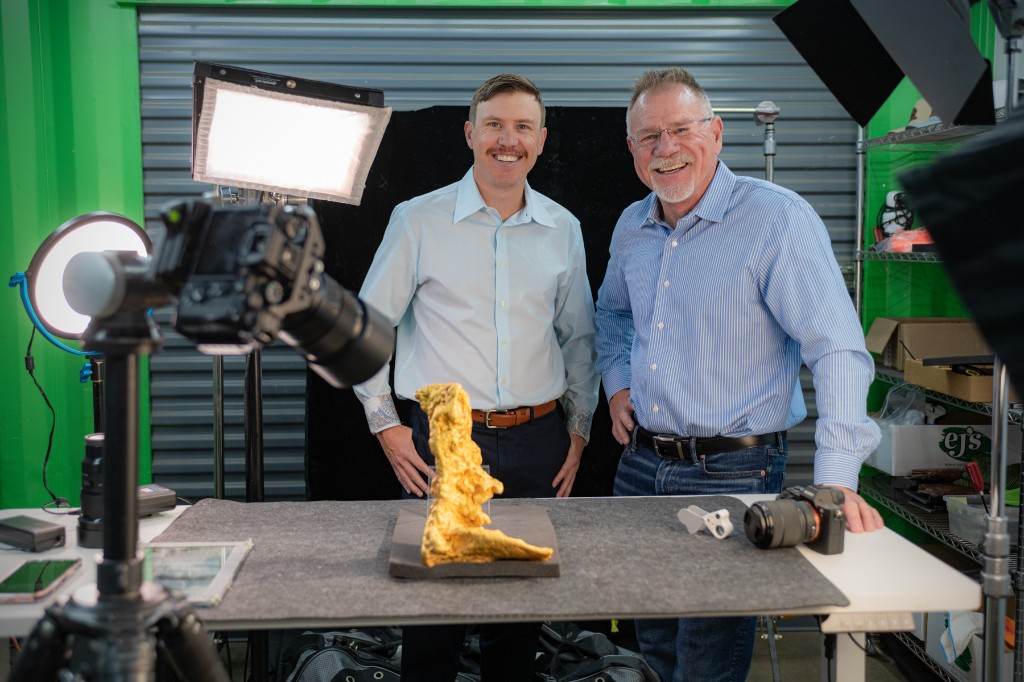 Garrett Hoyer and Erik Hoyer with the Boot of Cortez gold nugget at a studio shoot
